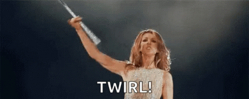 Woman Holding Microphone on Stage Saying Twirl