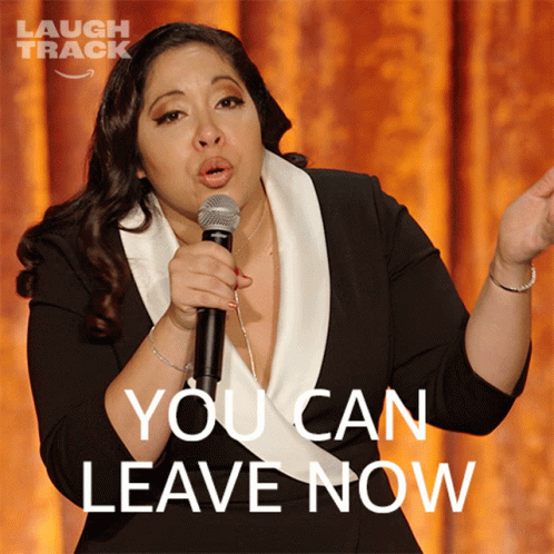 Woman Holding Microphone Saying You Can Leave Now