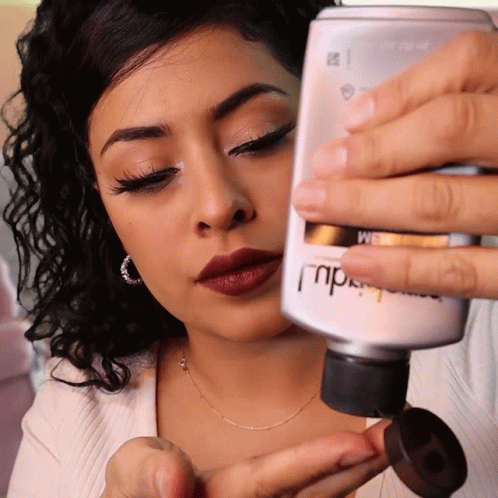 Woman Holding MPD Lotion Bottle