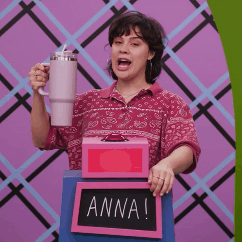 Woman Holding Mug and Box Saying Anna
