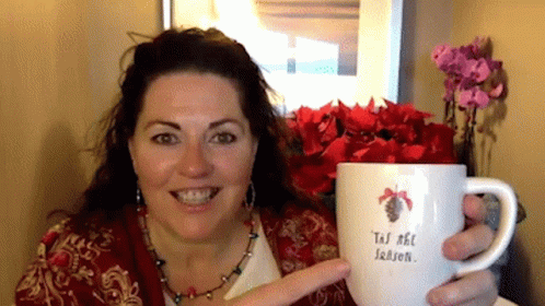 Woman Holding Mug Saying Tis the Season
