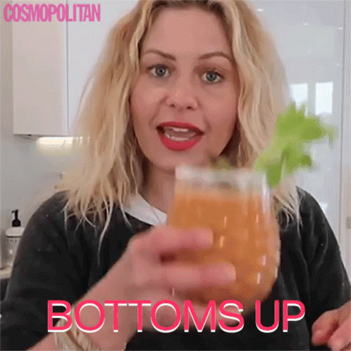 Woman Holding Orange Juice Bottoms Up