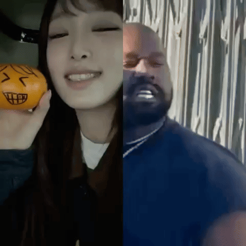 Woman Holding Orange Next to Man with Face