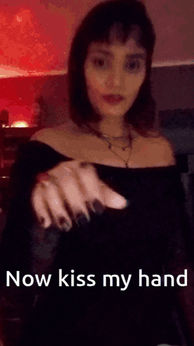 Woman Holding Out Hand Saying Now Kiss My Hand