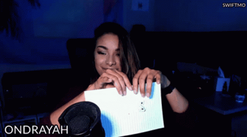 Woman Holding Paper at Microphone With Ondrayah
