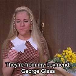 Woman Holding Paper Saying George Glass