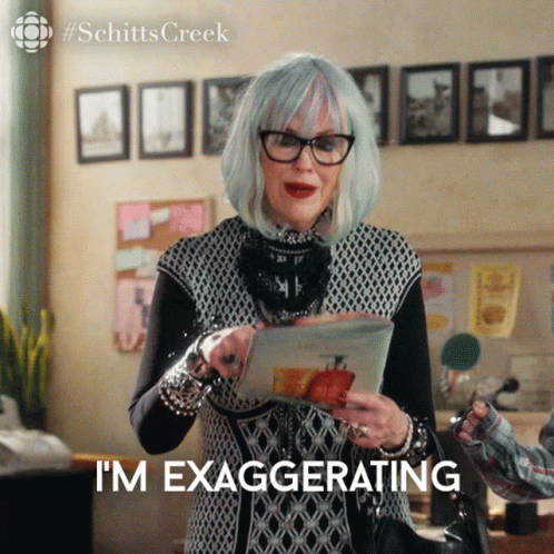 Woman Holding Paper Saying I'm Exaggerating