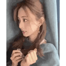 Woman Holding Perfume Bottle
