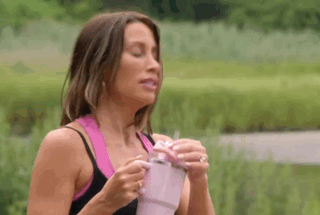 Woman Holding Pink Cup With Straw GIF