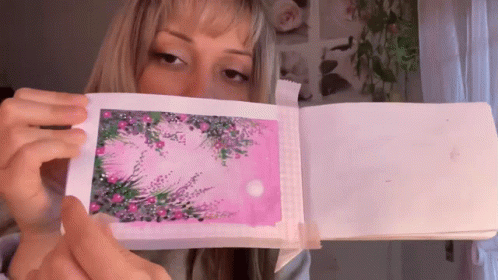 Woman Holding Pink Paper