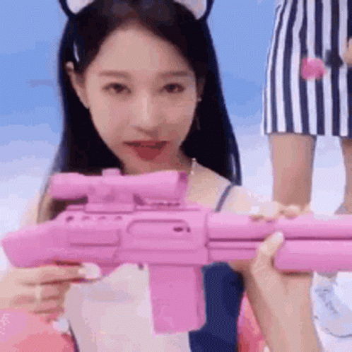 Woman Holding Pink Toy Gun GIF