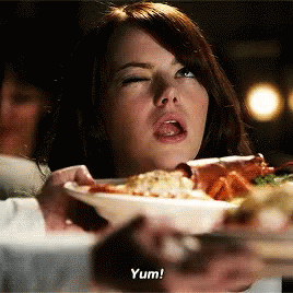 Woman Holding Plate Of Food Says Yum GIF
