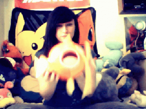 Woman Holding Pokemon Magikarp Stuffed Toy GIF