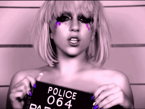 Woman Holding Police Mugshot