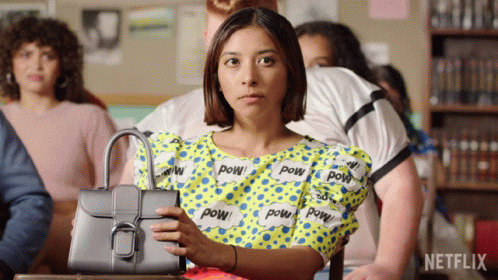 Woman Holding Purse in Front of Netflix Logo