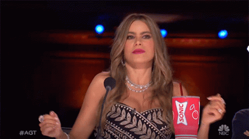 Woman Holding Red Cup Saying Sonic