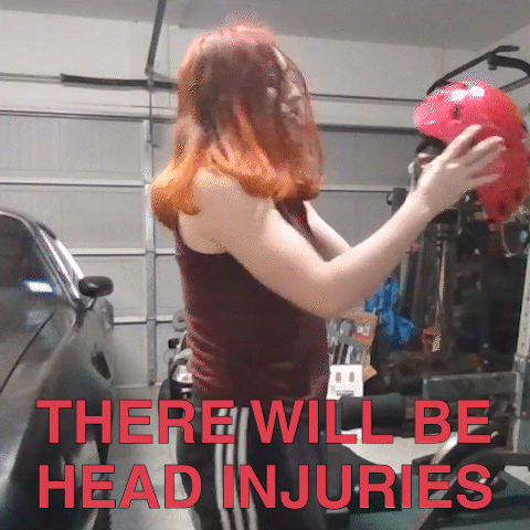 Woman Holding Red Helmet There Will Be Head Injuries