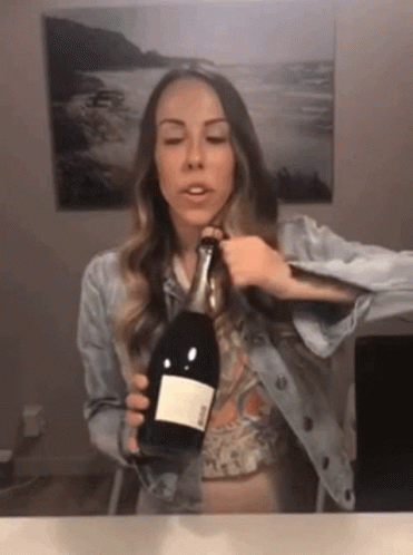 Woman Holding Ross Wine Bottle