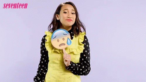 Woman Holding Sad Emoji Sensible Chuckle GIF