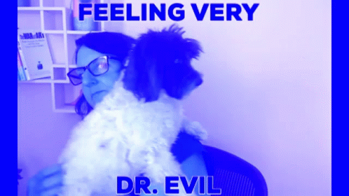 Woman Holding Small Dog With Feeling Very Dr. Evil GIF