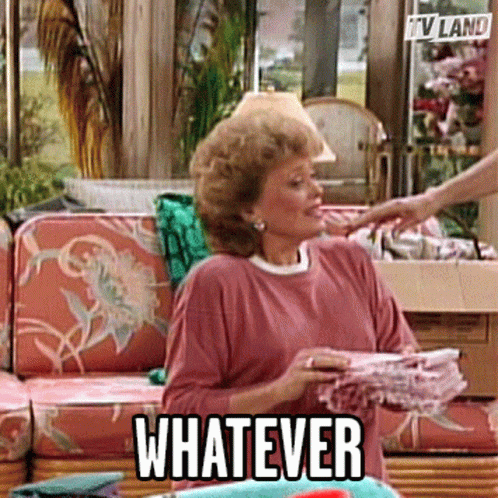 Woman Holding Stack of Clothes Saying Whatever
