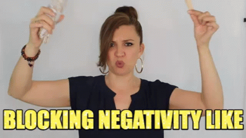 Woman Holding Stick Making Face Blocking Negativity
