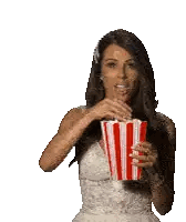 Woman Holding Striped Popcorn Bucket