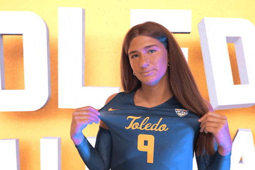 Woman Holding Toledo Jersey Number 9