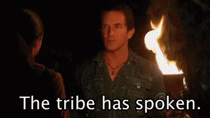 Woman Holding Torch Saying The Tribe Has Spoken
