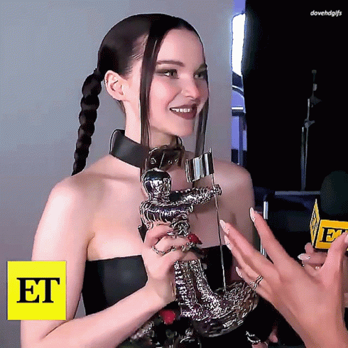 Woman Holding Trophy With Word Et
