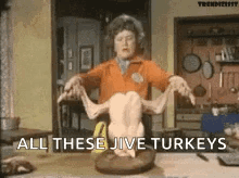 Woman Holding Turkey Saying All These Jive Turkeys GIF