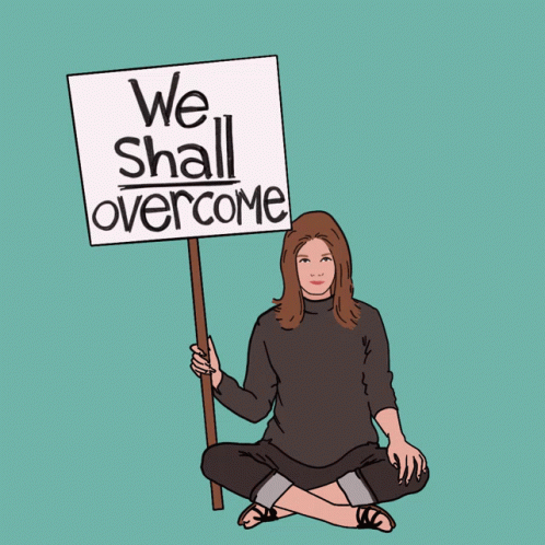 Woman Holding We Shall Overcome Sign