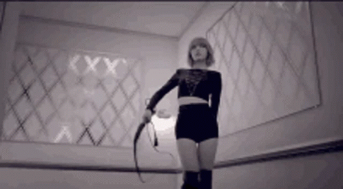 Woman Holding Whip GIF