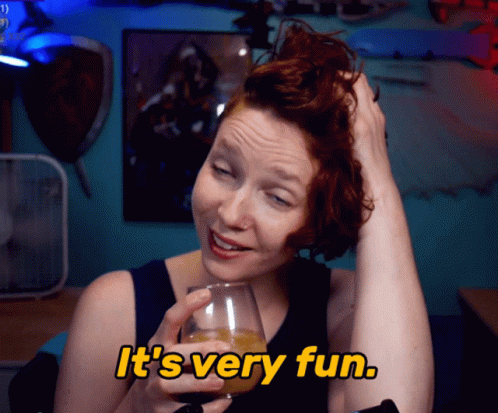 Woman Holding Wine Glass Saying It's Very Fun