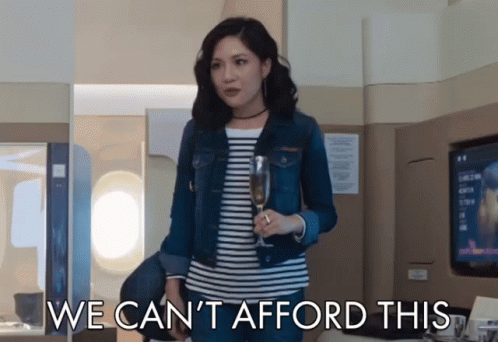 Woman Holding Wine Glass Saying We Cant Afford This