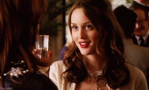 Woman Holding Wine Next To Woman With Blushpink GIF