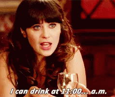 Woman Holding Wine Saying I Can Drink At 11:00 AM GIF