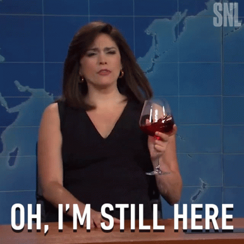 Woman Holding Wine Saying Oh I'm Still Here GIF