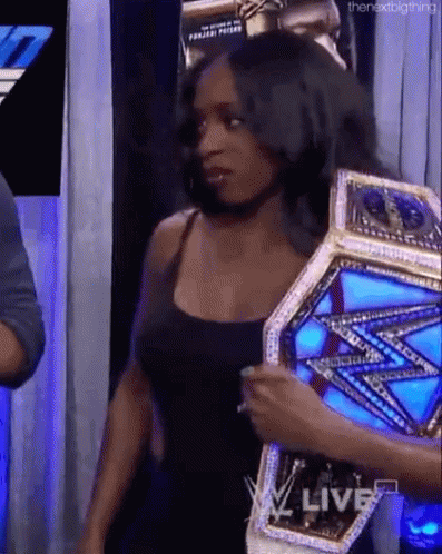 Woman Holding Wrestling Championship Belt
