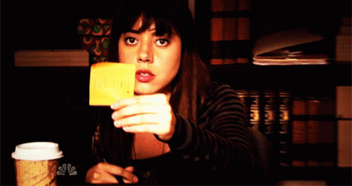 Woman Holding Yellow Help Note