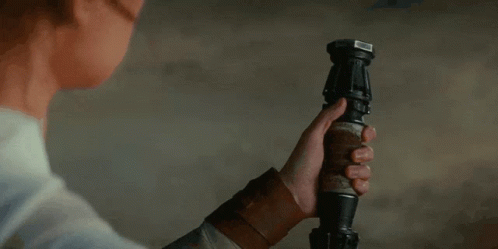 Woman Holding Yellow Lightsaber