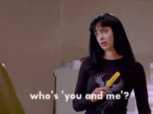 Woman Holding Yellow Popsicle Saying Who's You and Me