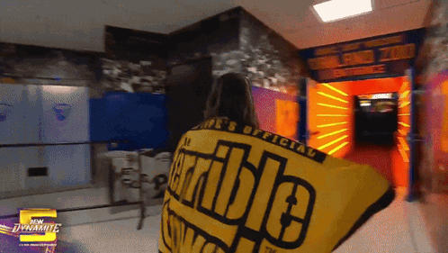 Woman Holding Yellow Shirt Saying Incredible GIF
