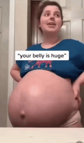Woman Huge Pregnant Belly Carrying Twins GIF