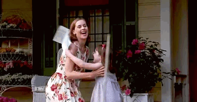 Woman Hugging Girl on Porch