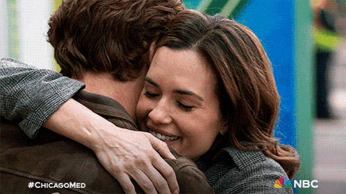 Woman Hugging Man With Chicagomed Logo