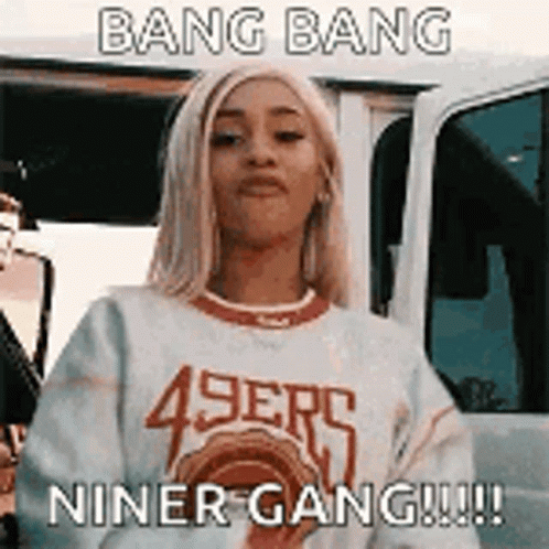 Woman In 49Ers Sweater Standing In Front Of Car GIF