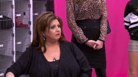 Woman in Abby Lee Dance Shirt at Whiteboard