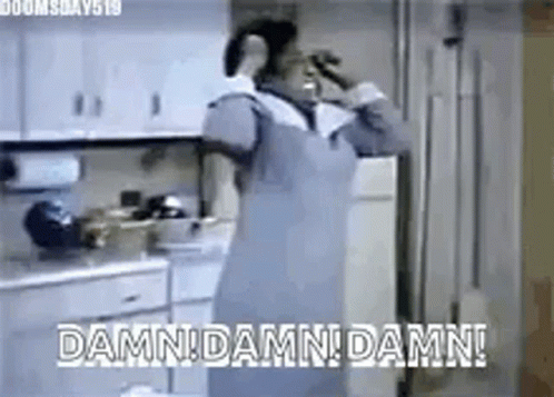 Woman In Apron Drinking Water In Kitchen GIF