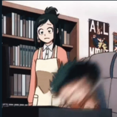 Woman in Apron Standing Next to Man in Library